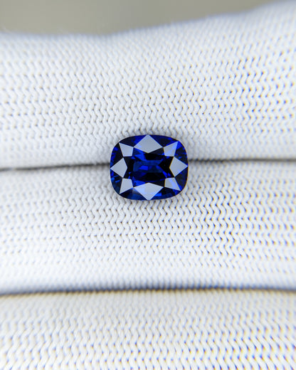 4.03 Carat Cushion Cut Heat Blue Sapphire Loose Gemstone on hand closeup