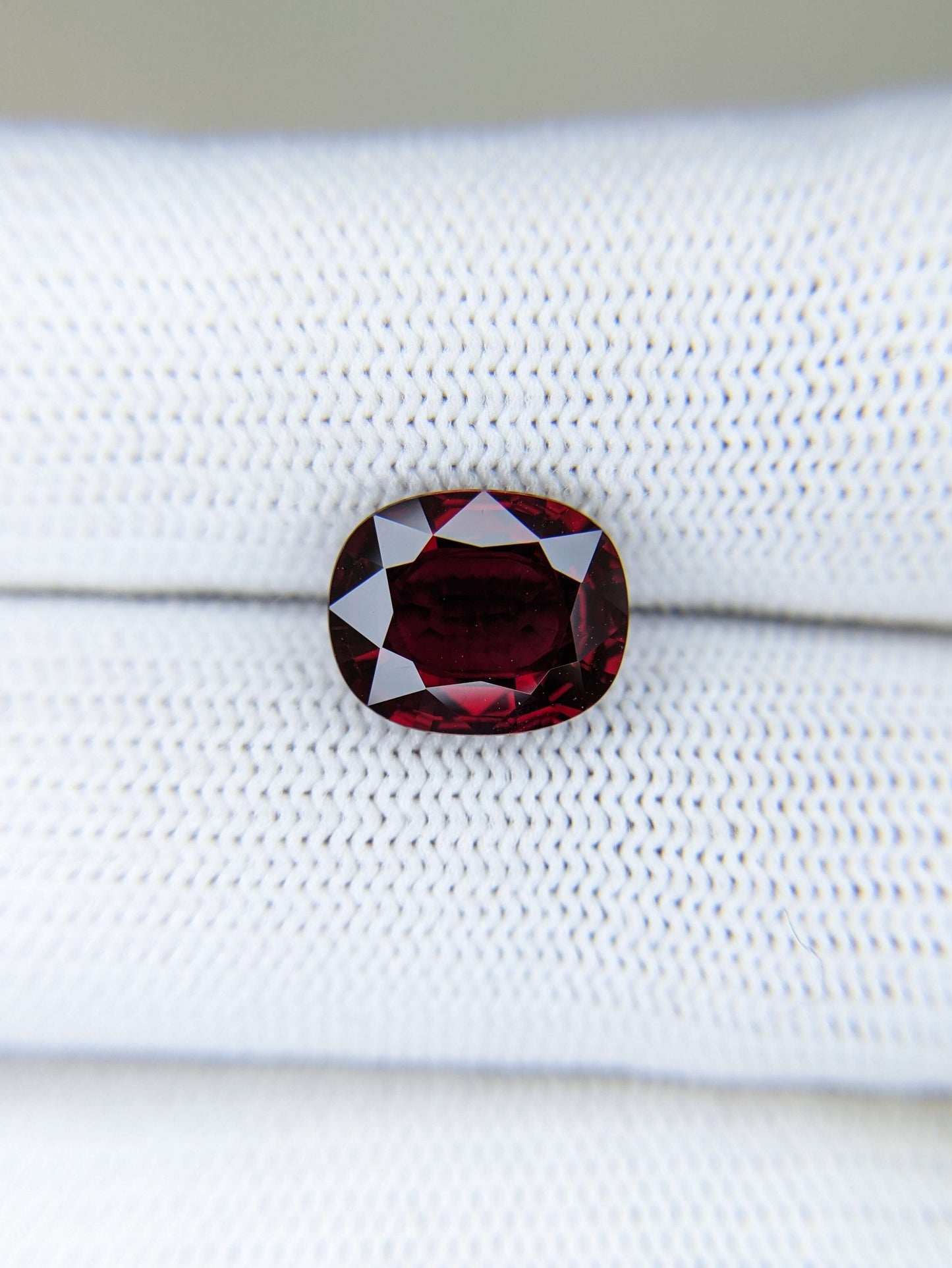 Red ruby gemstone on a white background