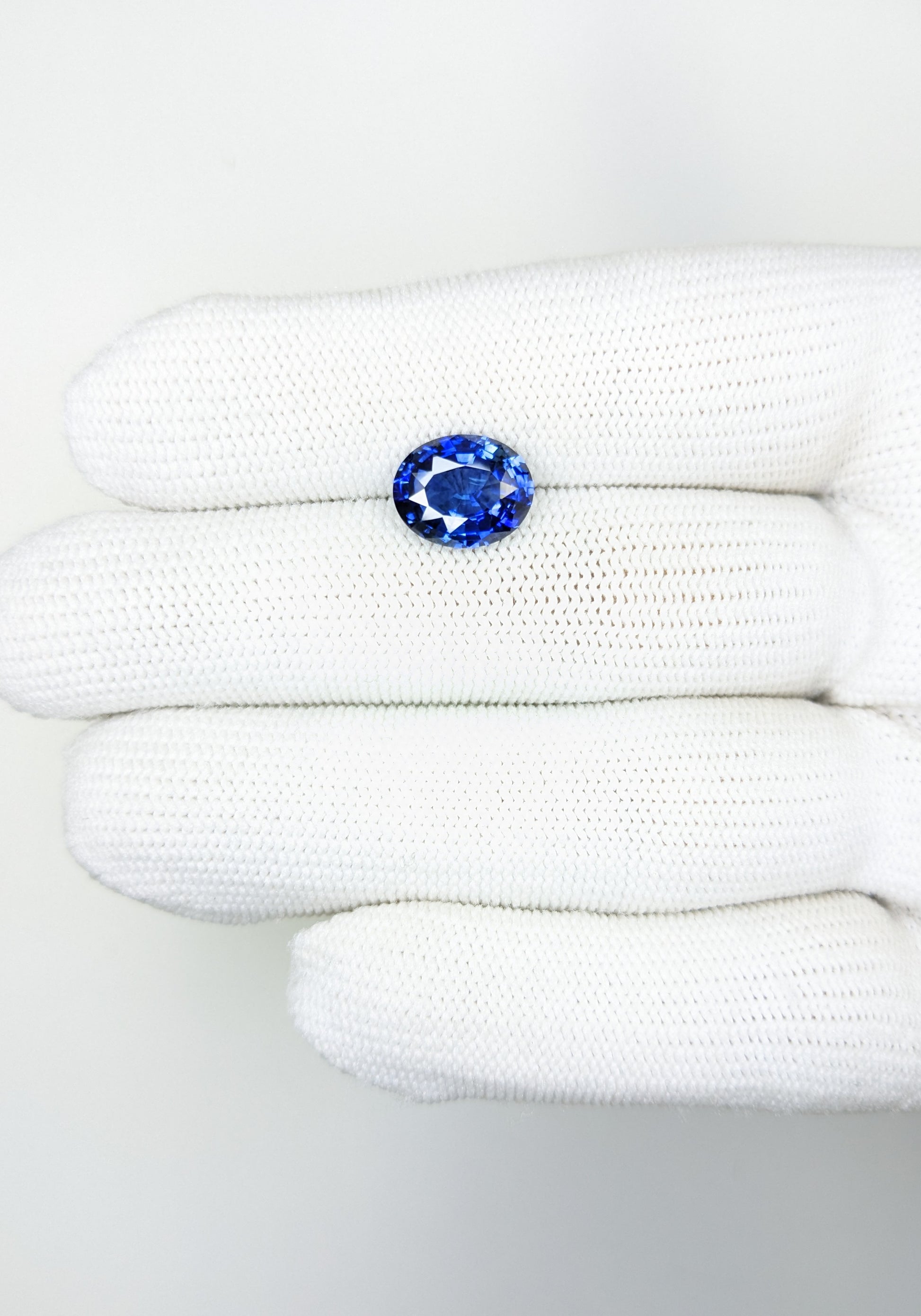 4.20 Carat Oval Cut Heat Blue Sapphire Loose Gemstone on hand