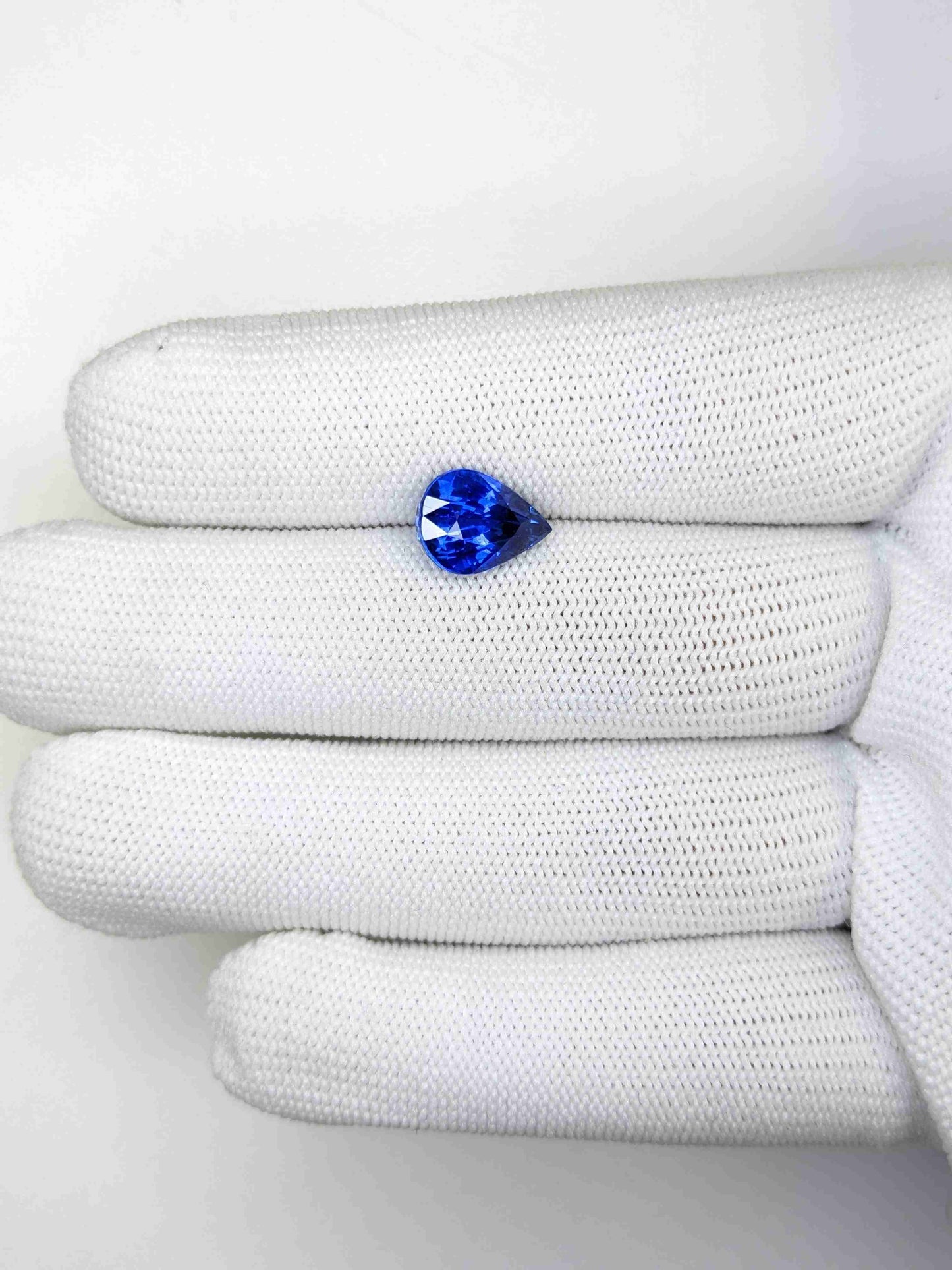 4.22 Carat Pear Cut Heat Blue Sapphire Loose Gemstone on hand