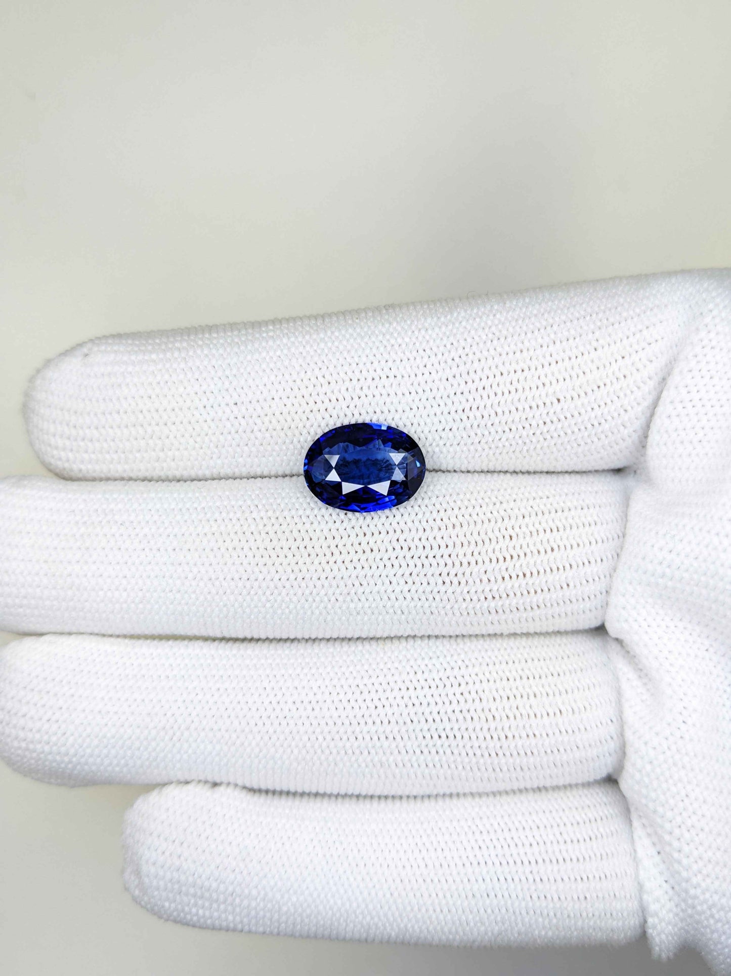 4.24 Carat Oval Cut Heat Blue Sapphire Loose Gemstone on hand