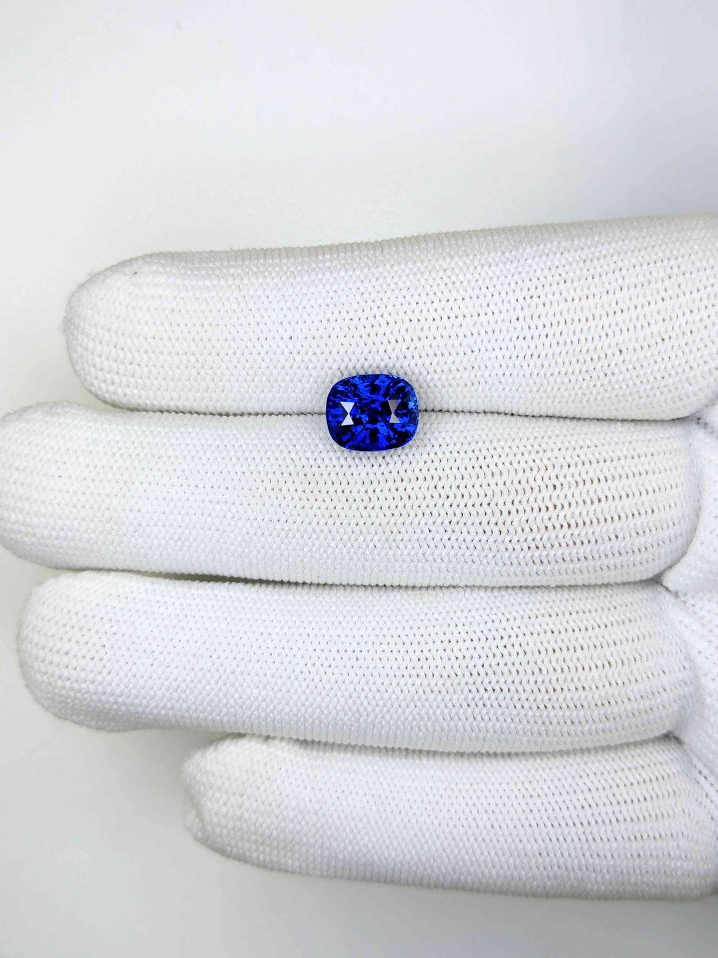 4.28 Carat Cushion Cut Heat Blue Sapphire Loose Gemstone On Hand