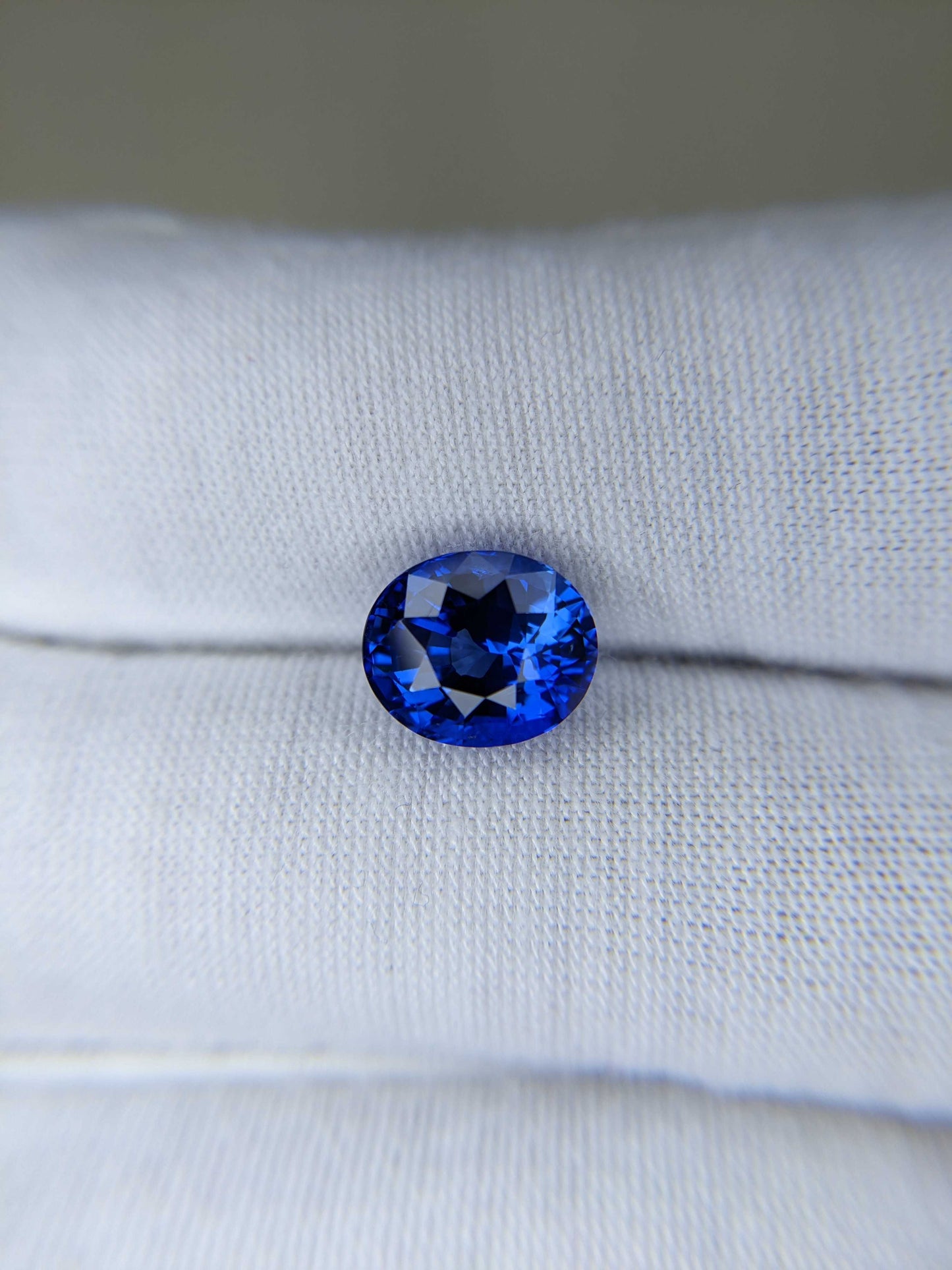 4.38 Carat Oval Cut Heat Blue Sapphire Loose Gemstone on hand