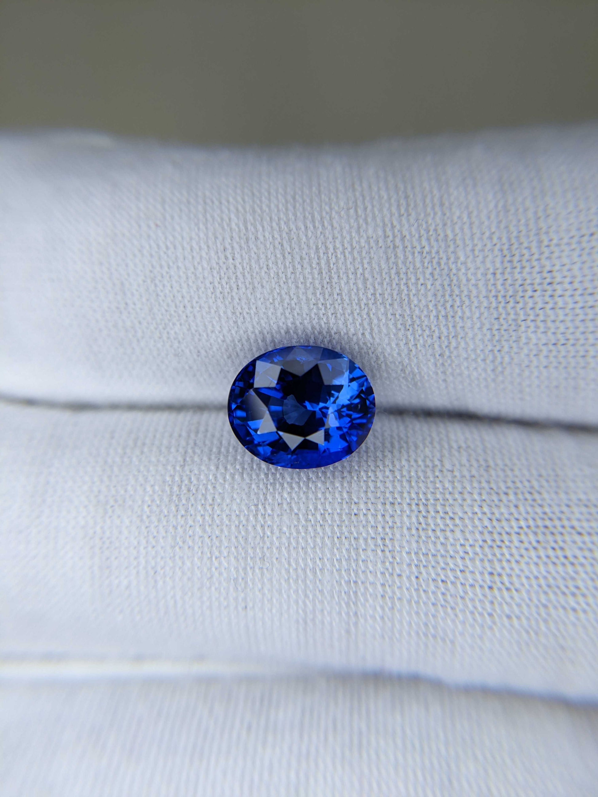 4.38 Carat Oval Cut Heat Blue Sapphire Loose Gemstone on hand