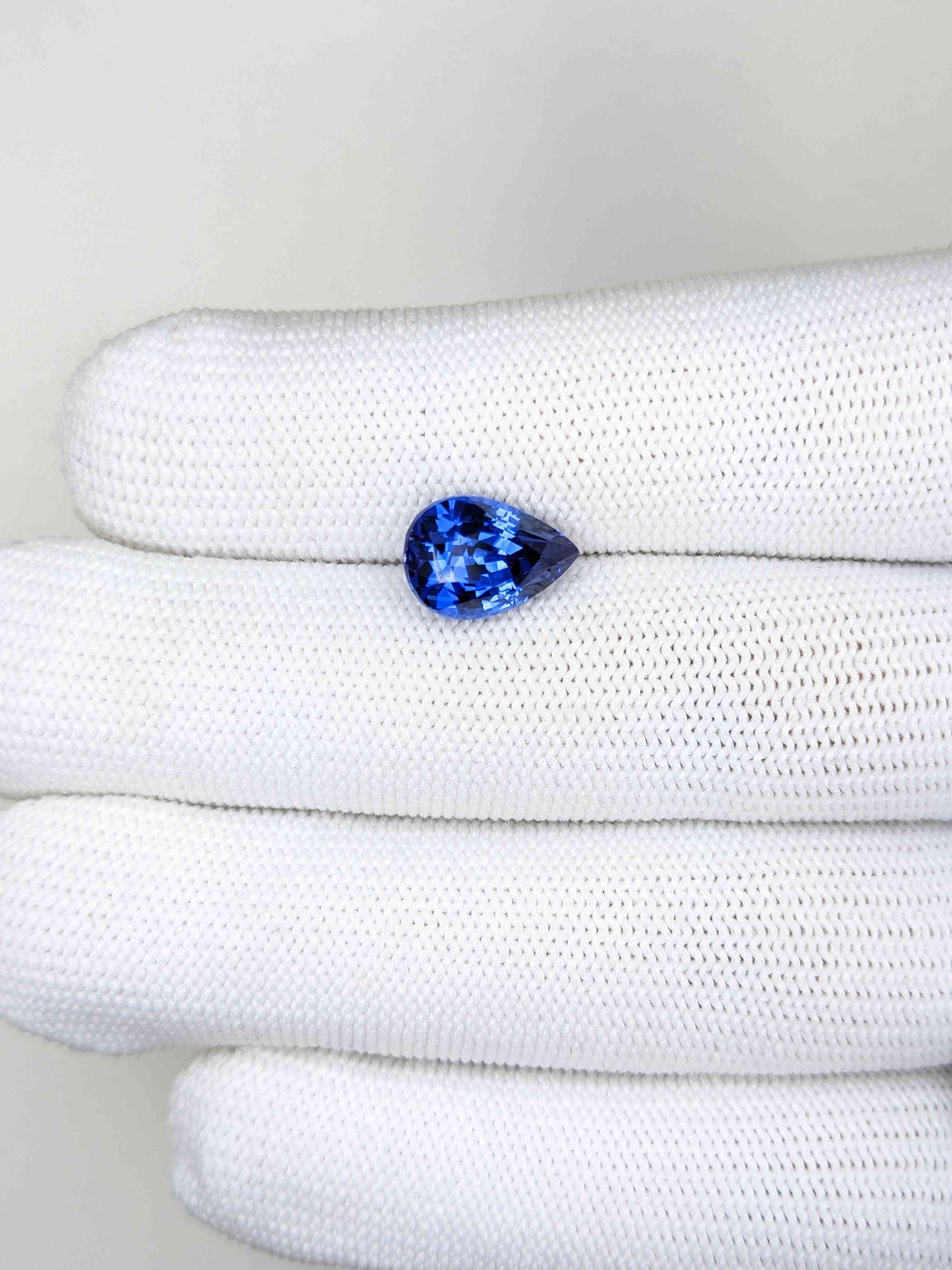4.42 Carat Pear Cut Heat Blue Sapphire Loose Gemstone On Hand