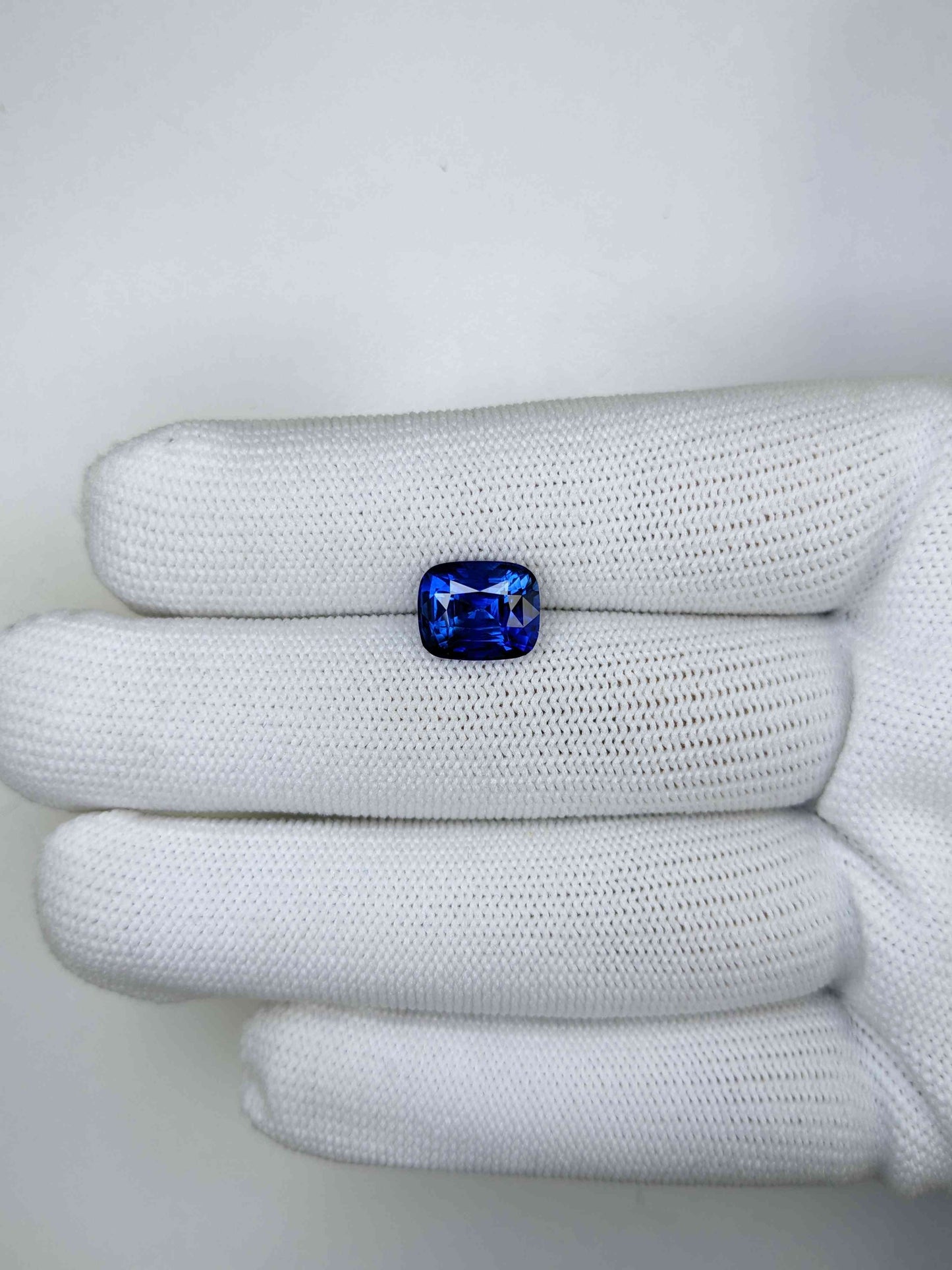 4.47 Carat Cushion Cut Heat Blue Sapphire Loose Gemstone On Hand