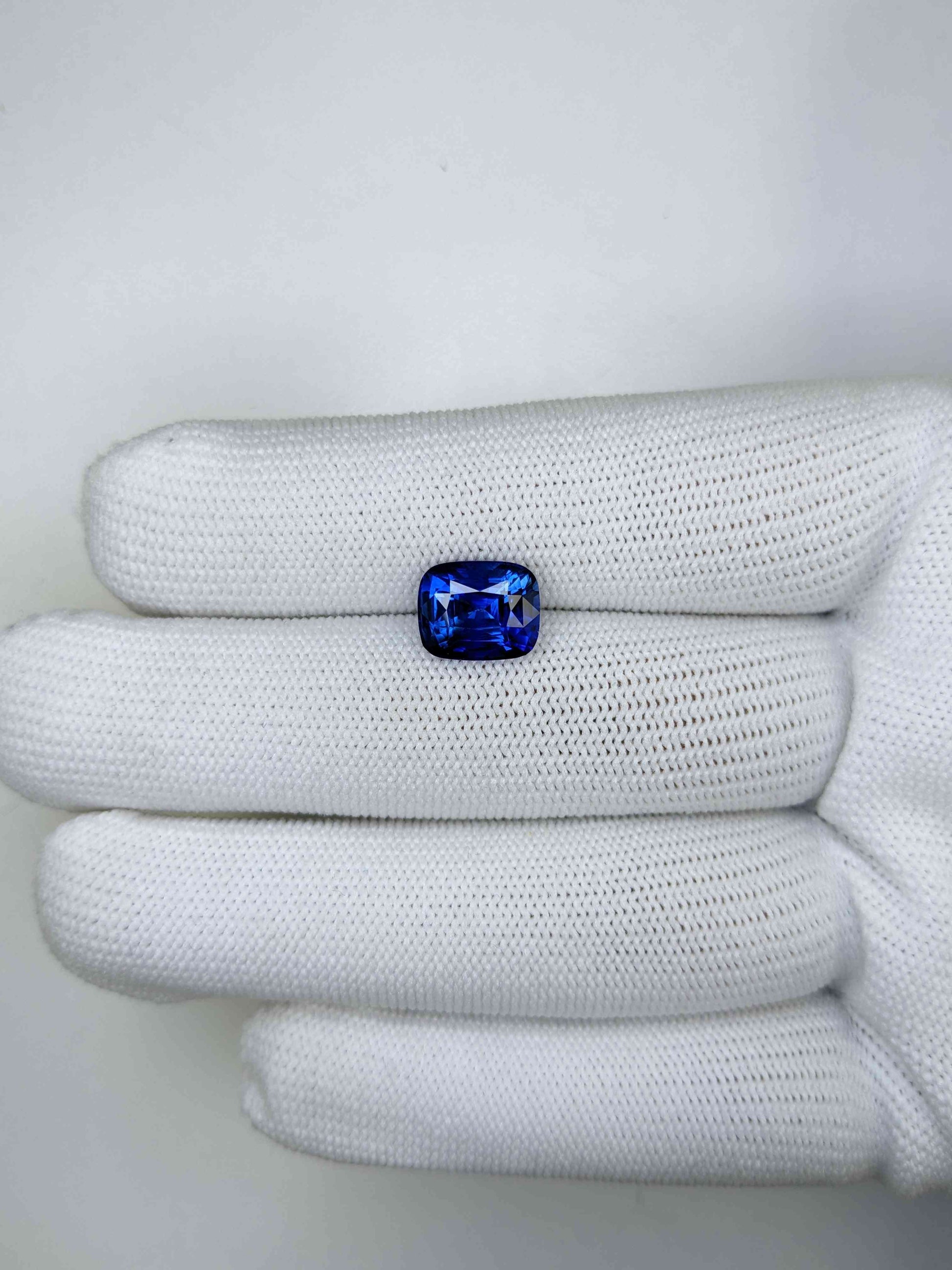 4.47 Carat Cushion Cut Heat Blue Sapphire Loose Gemstone On Hand