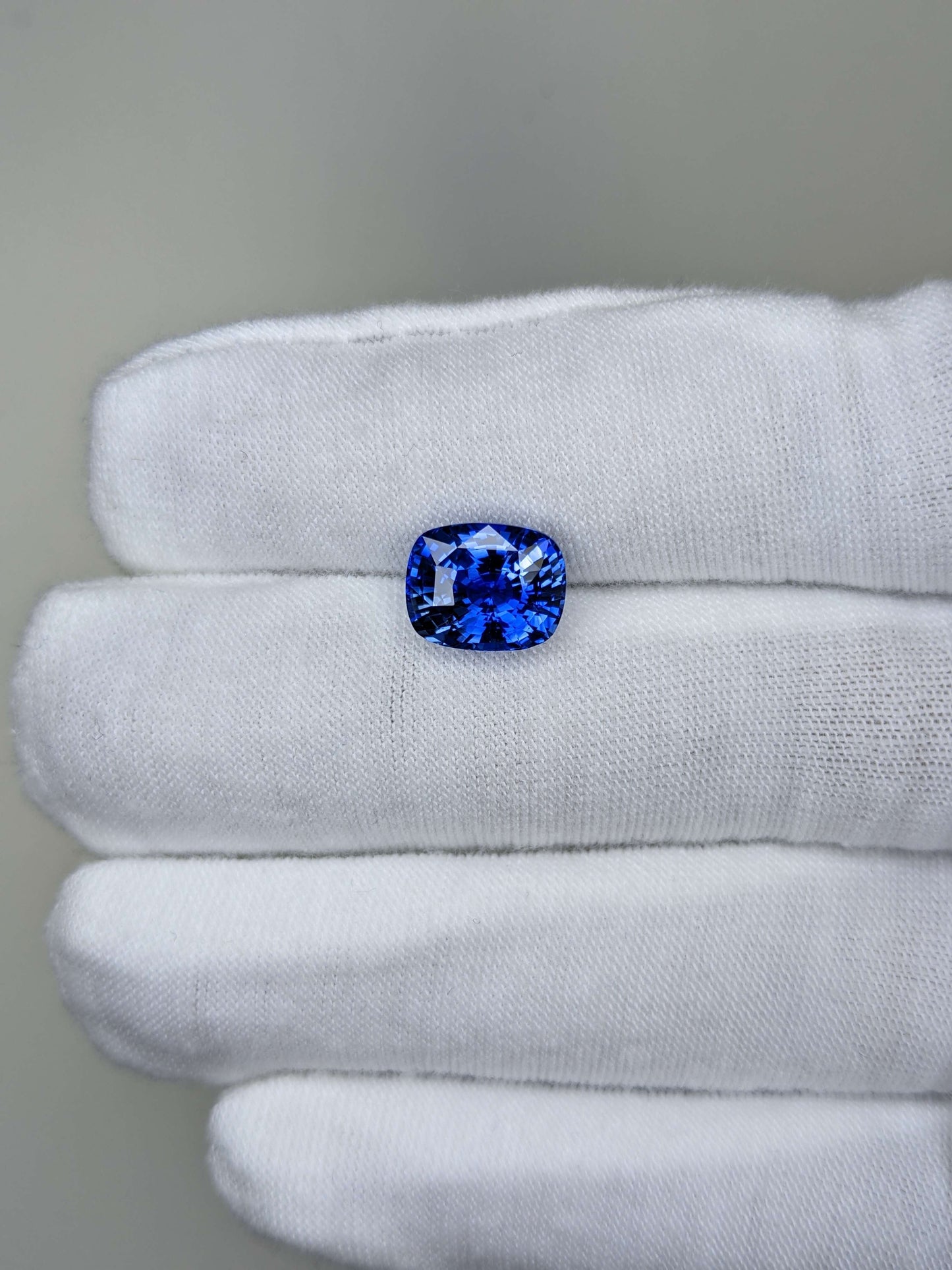 4.49 Carat Cushion Cut Heat Medium Blue Sapphire Loose Gemstone On Hand