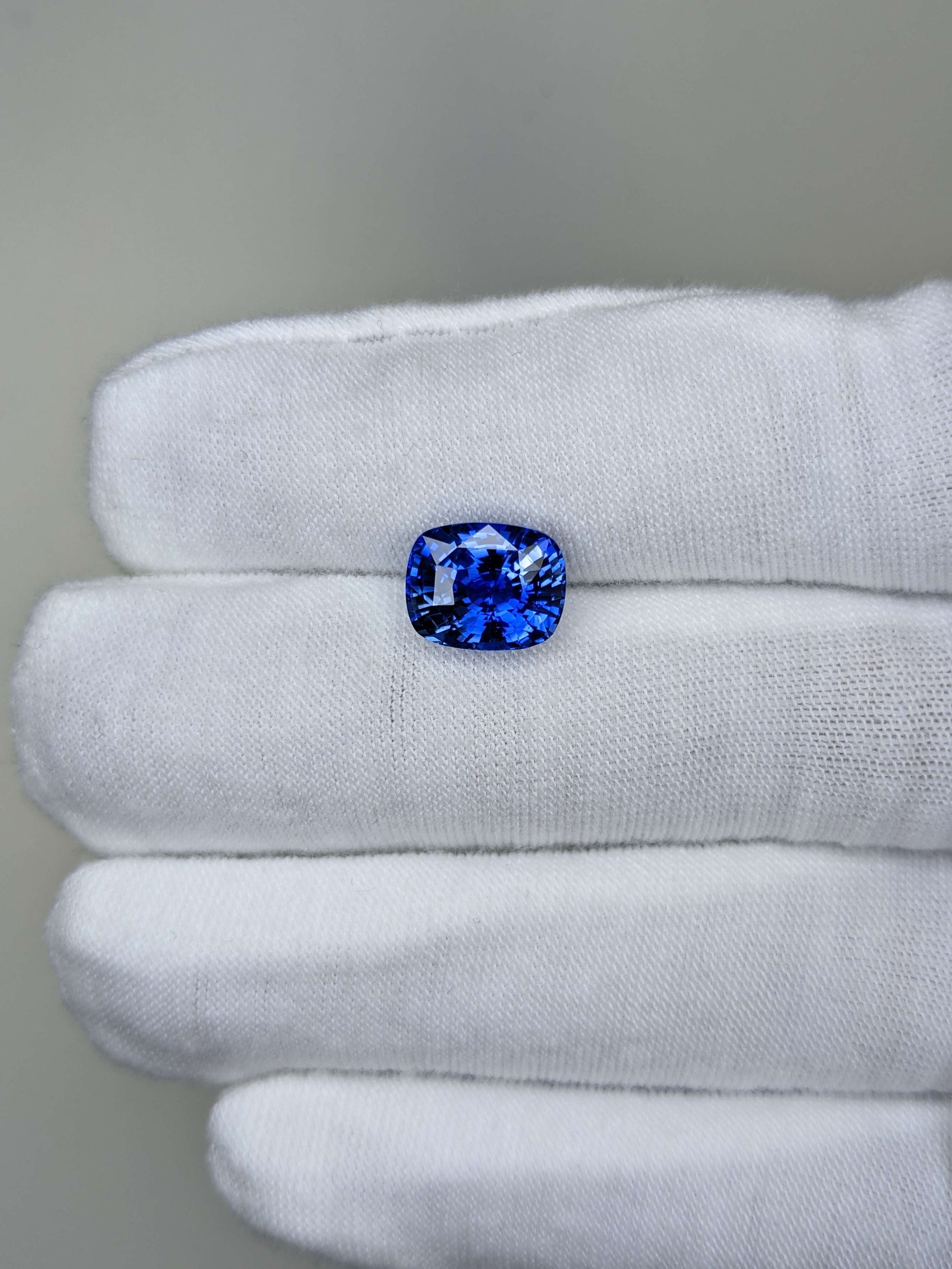 4.49 Carat Cushion Cut Heat Medium Blue Sapphire Loose Gemstone On Hand