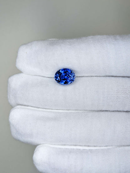 4.56 Carat Oval Cut Heat Medium Blue Sapphire Loose Gemstone On Hand