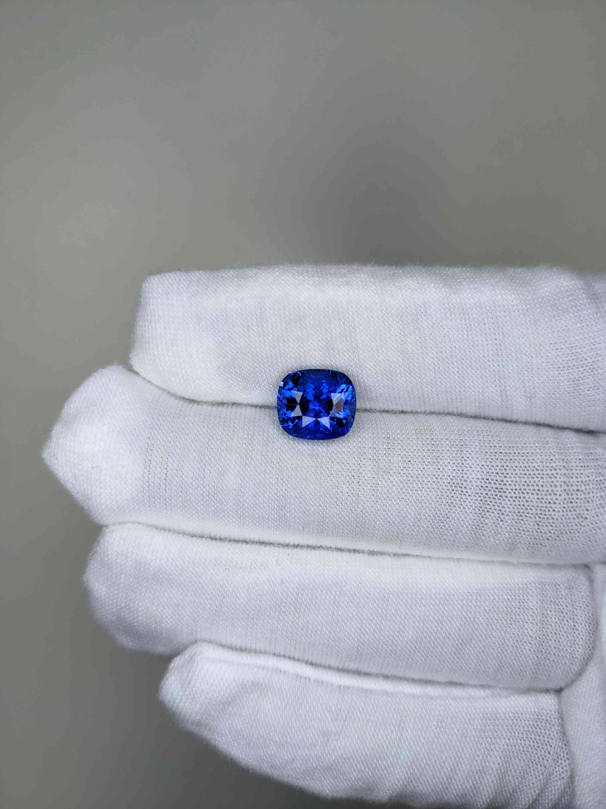 4.94 Carat Cushion Cut Heat Blue Sapphire Loose Gemstone On Hand