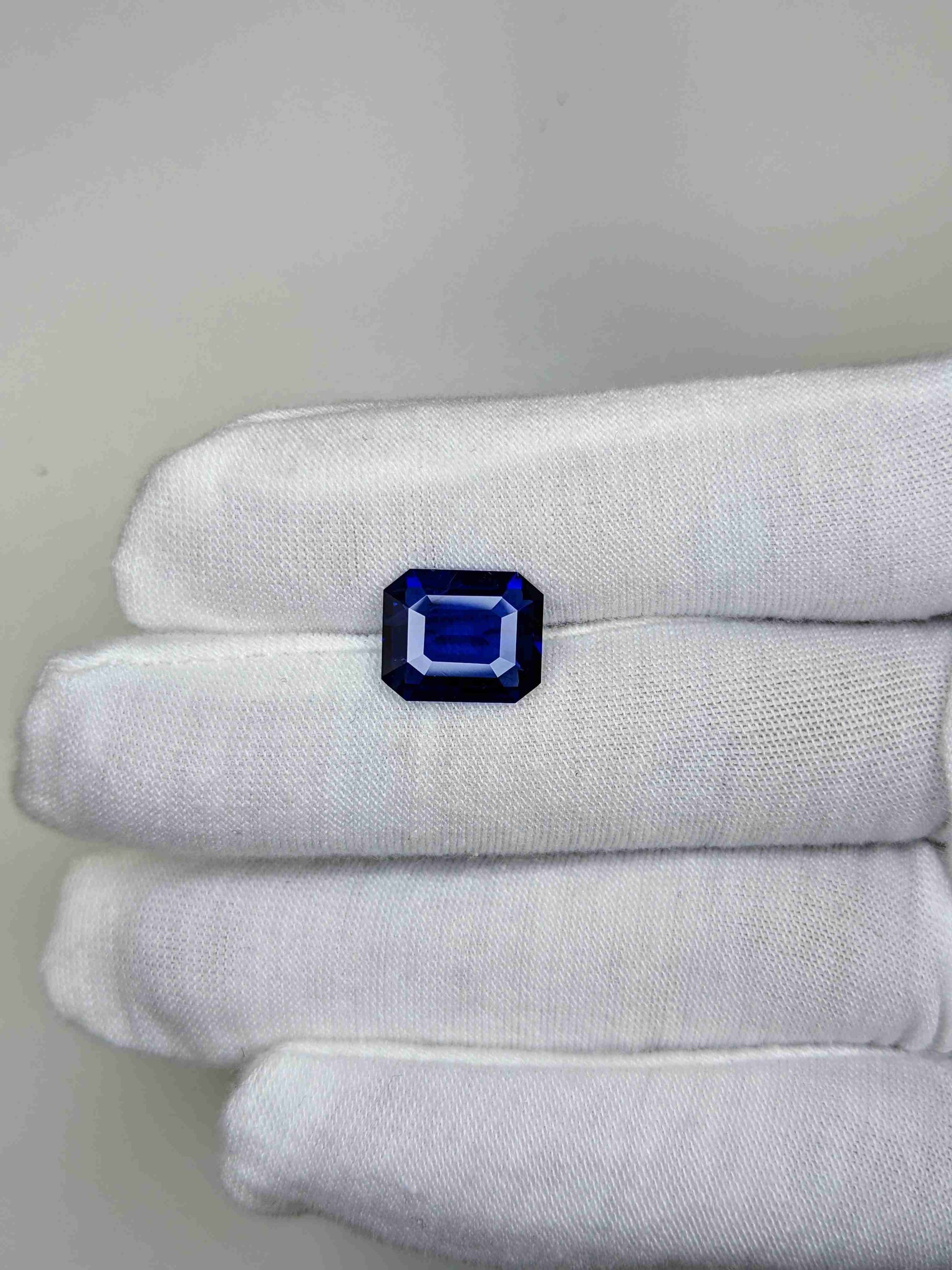 5.05 Carat Octagonal Cut Heat Blue Sapphire Loose Gemstone on hand