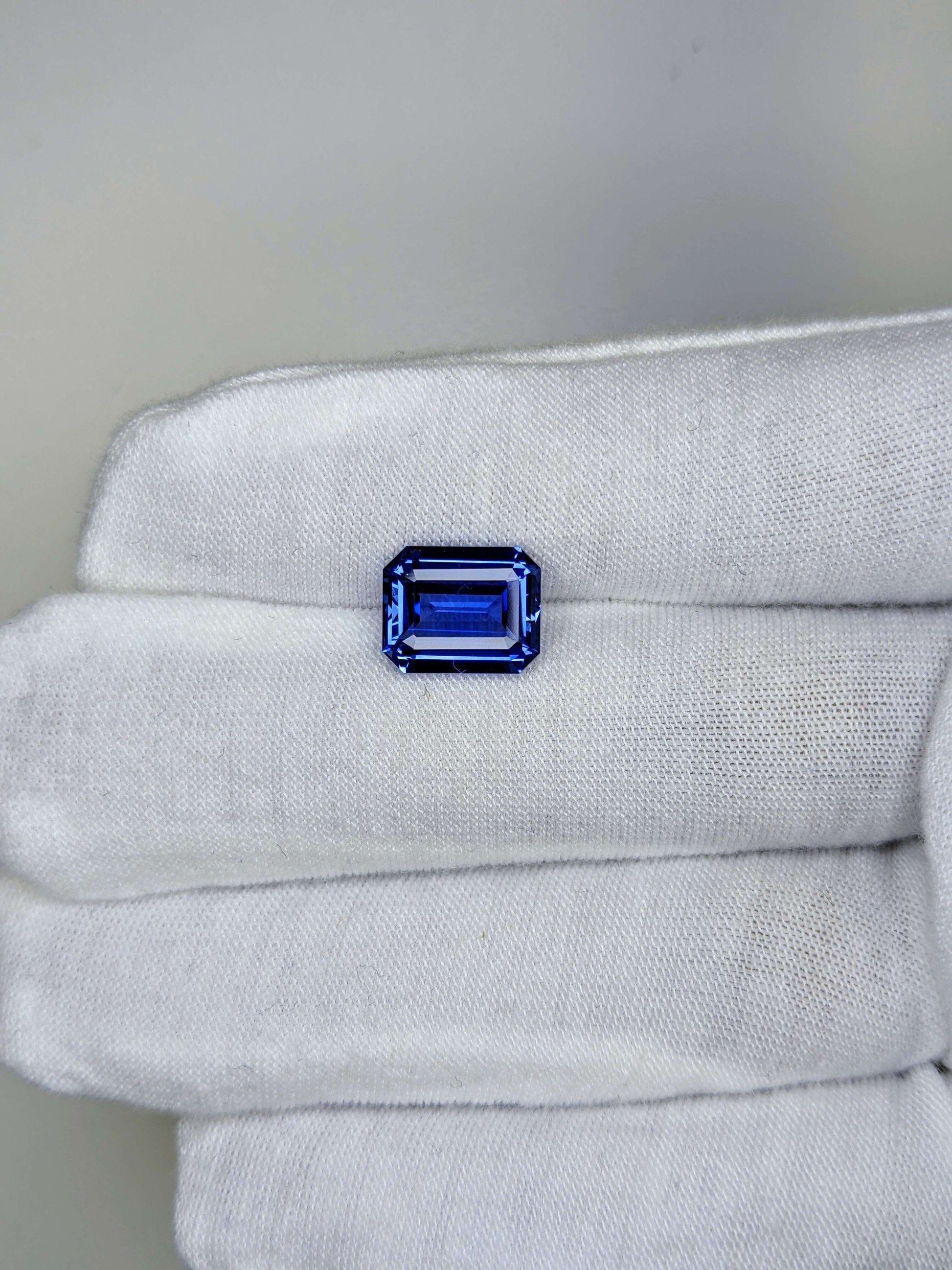 5.06 Carat Emerald Cut Heat Medium Blue Sapphire Loose Gemstone On Hand