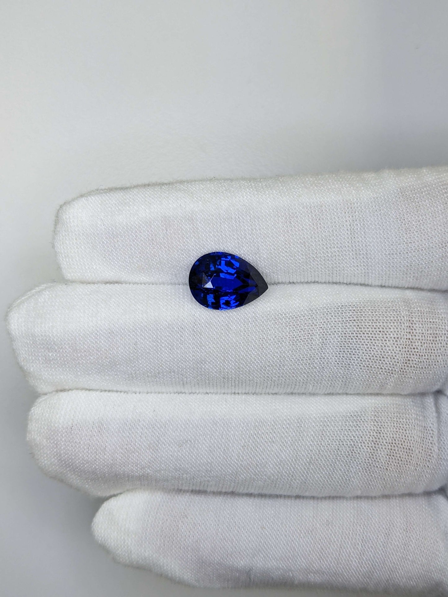 5.21 Carat Pear Cut Heat Royal Blue Sapphire Loose Gemstone On Hand