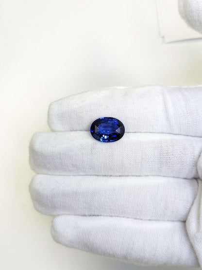 6.66 Carat Oval Cut Heat Medium Blue Sapphire Loose Gemstone On Hand