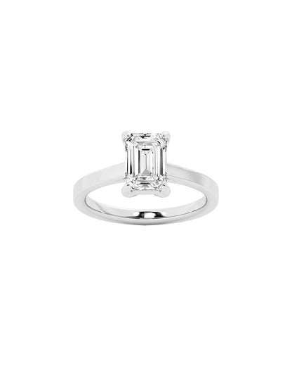 Diamond ring with emerald-cut diamond on a white background