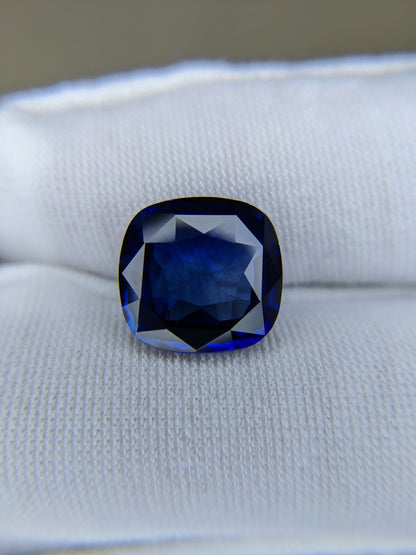 7.12 Carat Cushion Cut Heat Royal Blue Sapphire Loose Gemstone On Hand