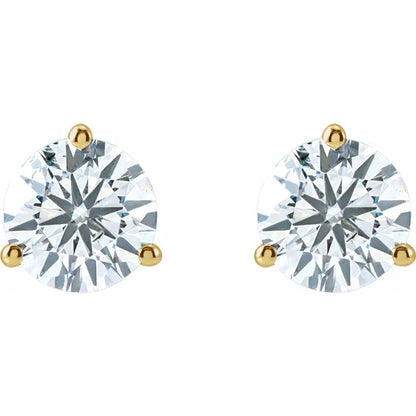 Pair of diamond stud earrings with gold prongs on a white background