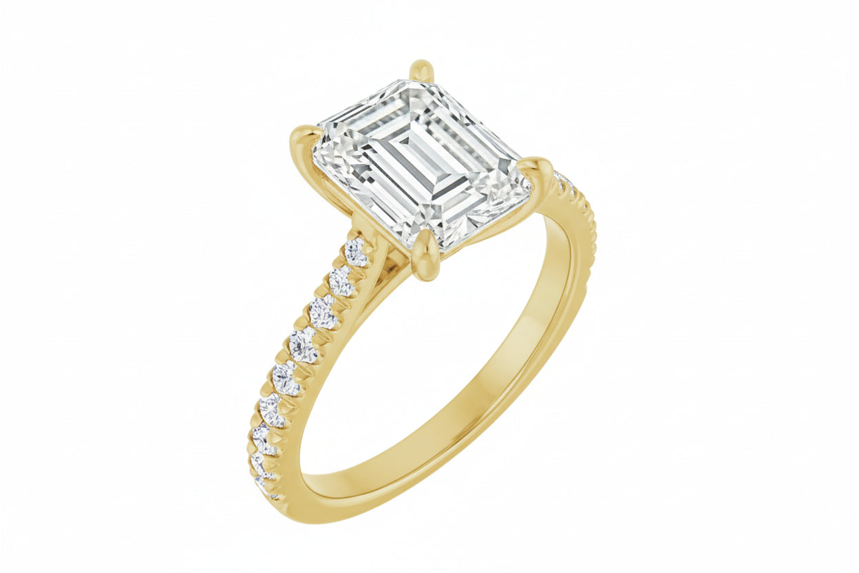 Gold ring with diamond accents on a white background