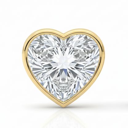Heart-shaped diamond with gold setting on a white background