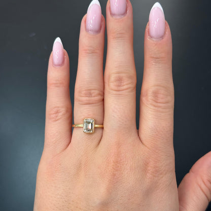 Dove 1.10 Carat Emerald Cut Diamond Solitaire Engagement Ring in 14k Yellow Gold On Hand