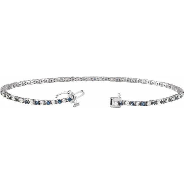 White gold bracelet with blue sapphire on a white background