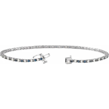 White gold bracelet with blue sapphire on a white background