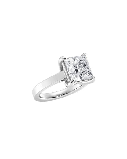 Diamond ring with a princess-cut diamond on a white background