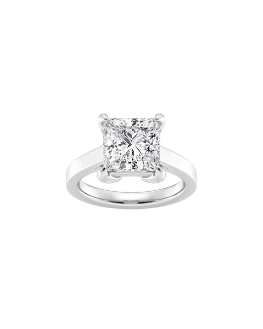 Diamond ring with a princess-cut gemstone on a white background