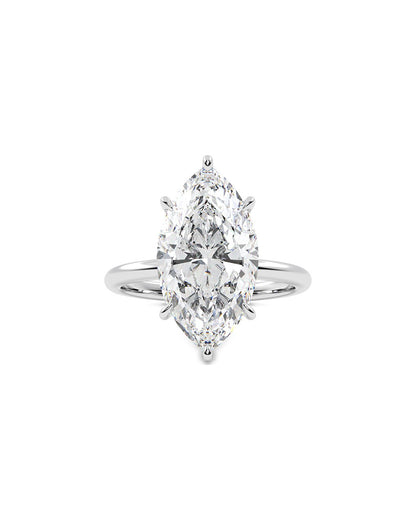 Diamond ring with a marquise-shaped center stone on a white background