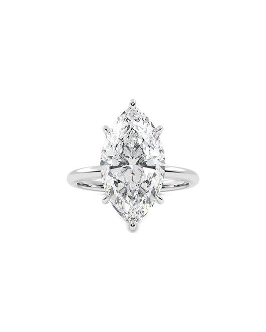 Diamond ring with a marquise-shaped center stone on a white background