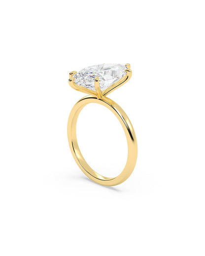 Gold ring with a marquise-shaped diamond on a white background