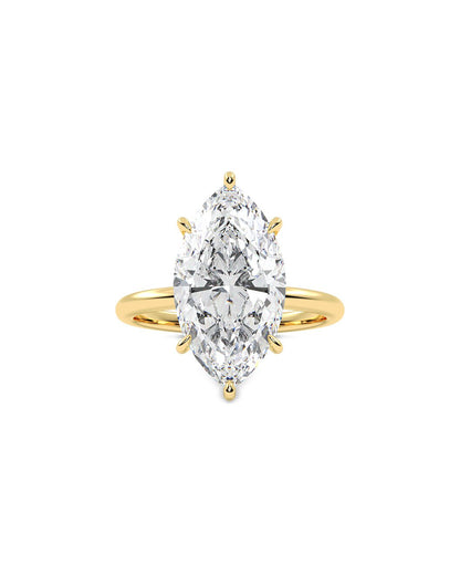 Gold ring with a large marquise-shaped diamond on a white background