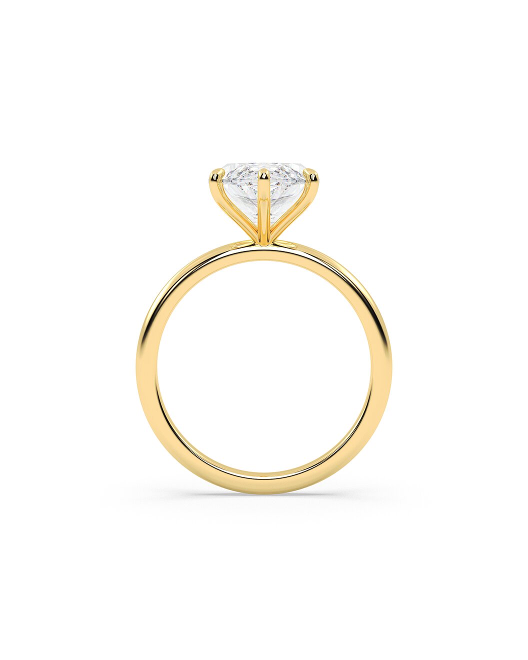 Gold ring with a clear gemstone on a white background