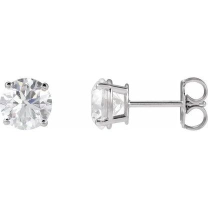 Pair of white gold stud earrings with clear diamond on a white background