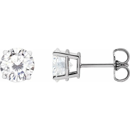 Two diamond earrings on a white background
