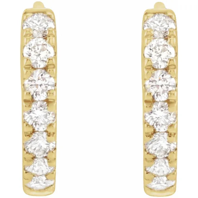 Gold hoop earrings with clear gemstones on a white background