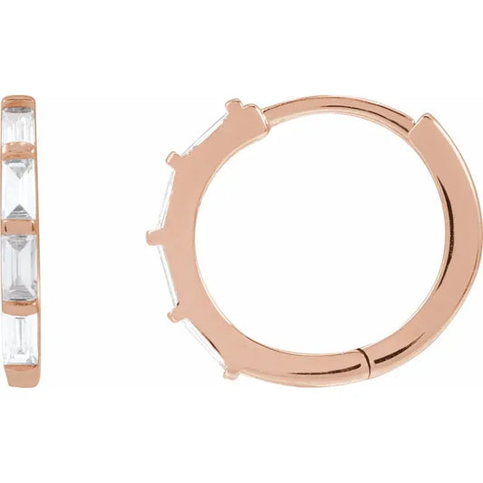 Rose gold hoop earring with clear diamonds on a white background
