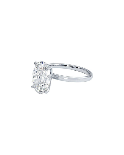 Diamond ring with an oval-shaped gemstone on a white background