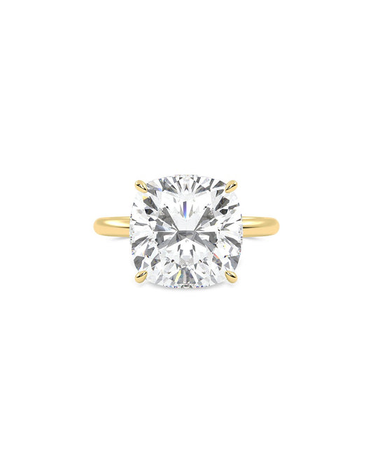 Laverne yellow gold ring with a large Cushion cut diamond on a white background