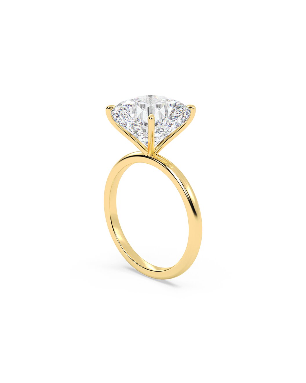 Yellow gold ring with a large cushion cut diamond on a white background