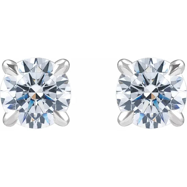 Pair of white gold stud earrings with clear diamonds on a white background