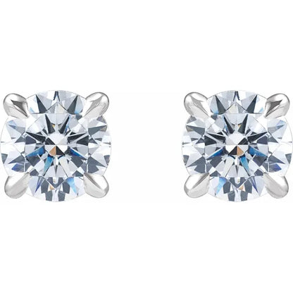 Pair of white gold stud earrings with clear diamonds on a white background
