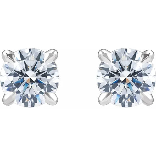 Pair of white gold stud earrings with clear diamonds on a white background