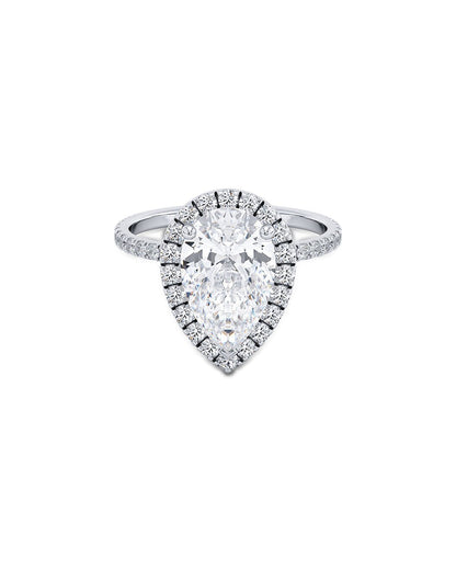 Diamond ring with pear-shaped center stone on a white background