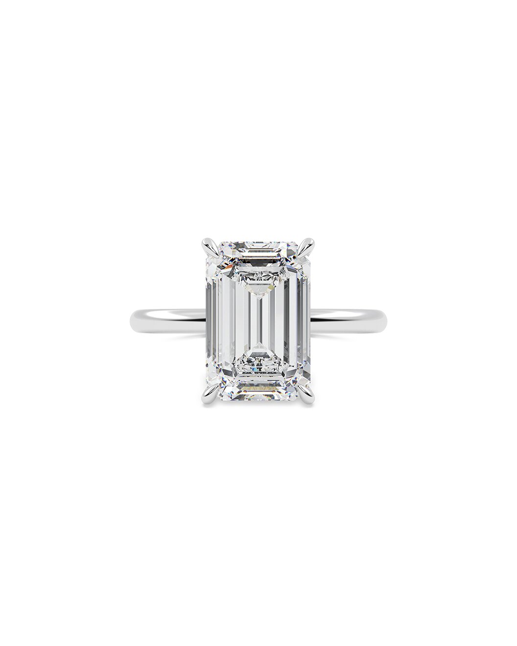 Diamond ring with emerald-cut gemstone on a white background