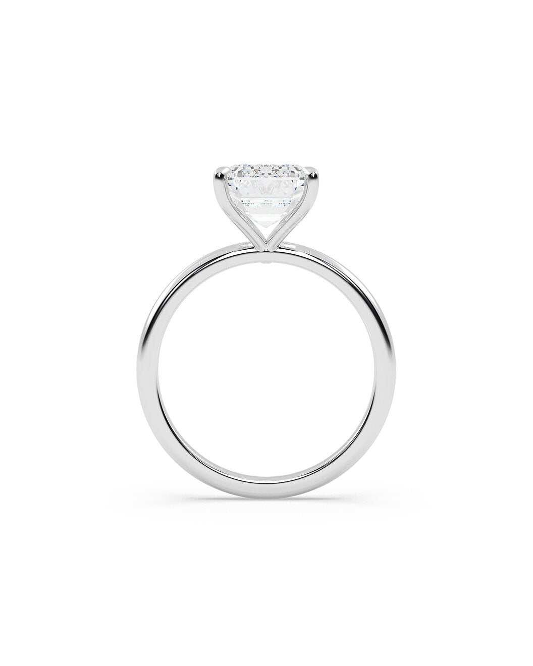 Diamond ring with an emerald cut on a white background