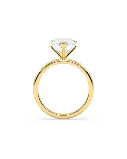 Gold ring with a diamond on a white background