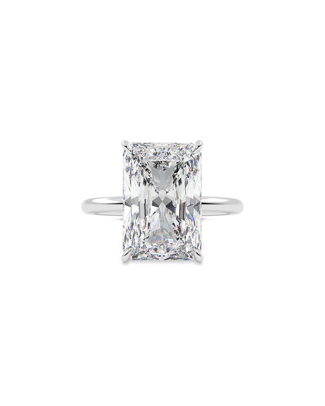 Diamond ring with a radiant cut gemstone on a white background