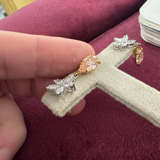 Diamond earrings on a stand in a jewelry store.